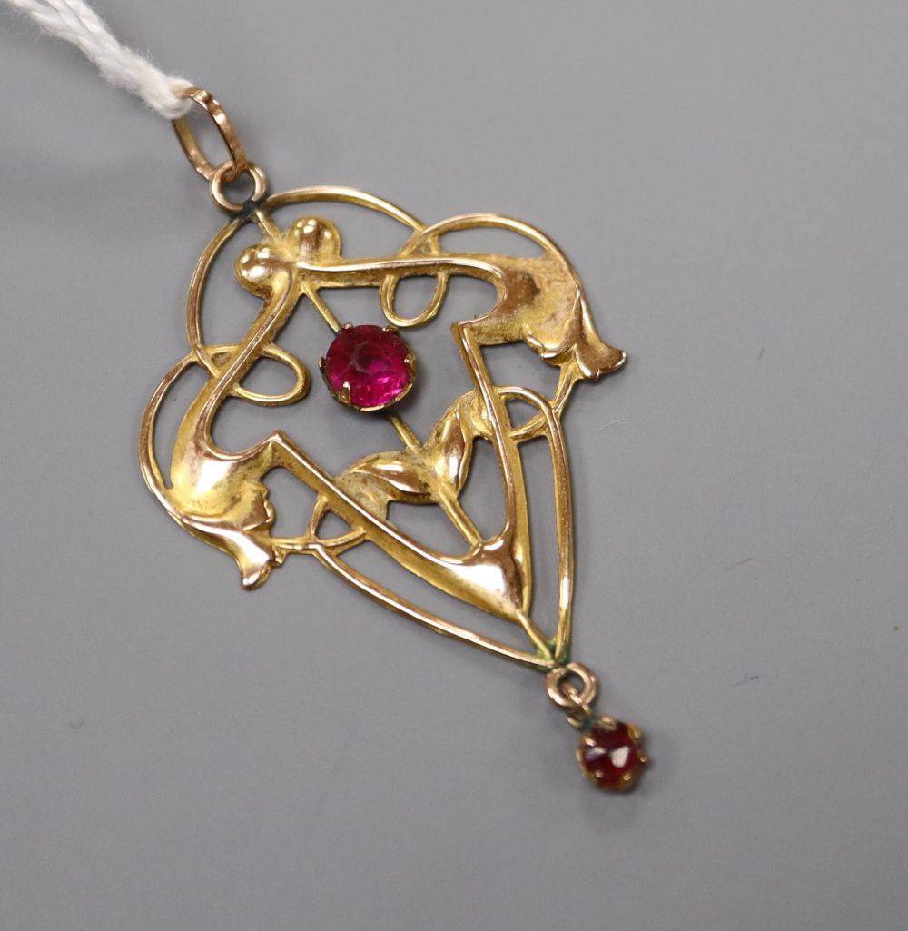 An Edwardian Art Nouveau 9ct and red paste set drop pendant, 46mm, gross 1.8 grams.